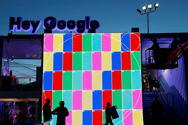 Technicians work on a Hey Google booth in front of the Las Vegas Convention Center in preparation for the 2018 CES in Las Vegas, Nevada, U.S. January 6, 2018
