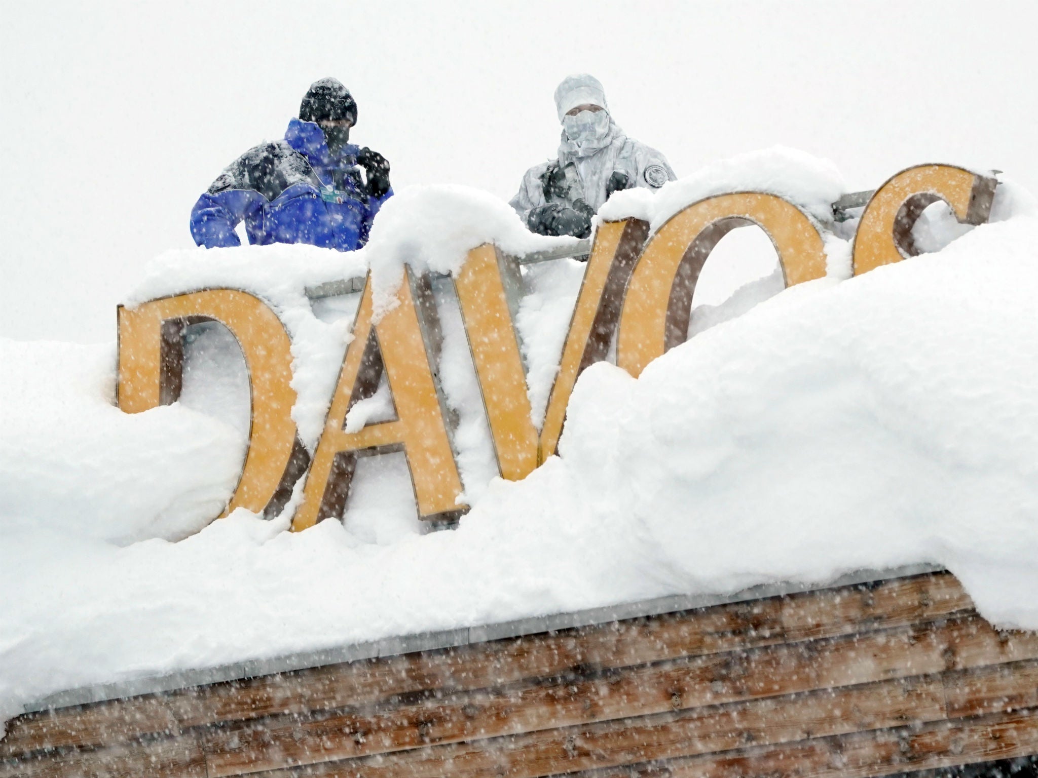 Snipers hold their position on the roof of a hotel during the World Economic Forum annual meeting in Davos, Switzerland