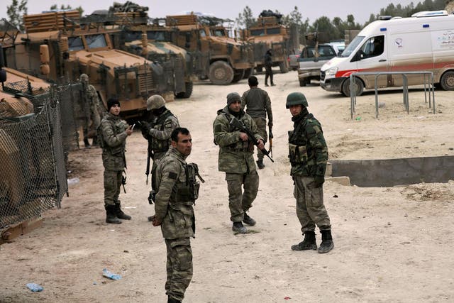 Turkish forces are seen near Mount Barsaya, northeast of Afrin, Syria