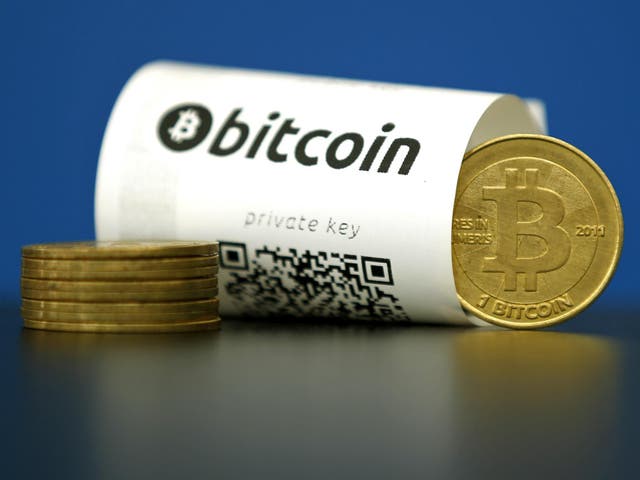 A Bitcoin (virtual currency) paper wallet with QR codes and a coin are seen in an illustration picture taken at La Maison du Bitcoin in Paris, France, May 27, 2015