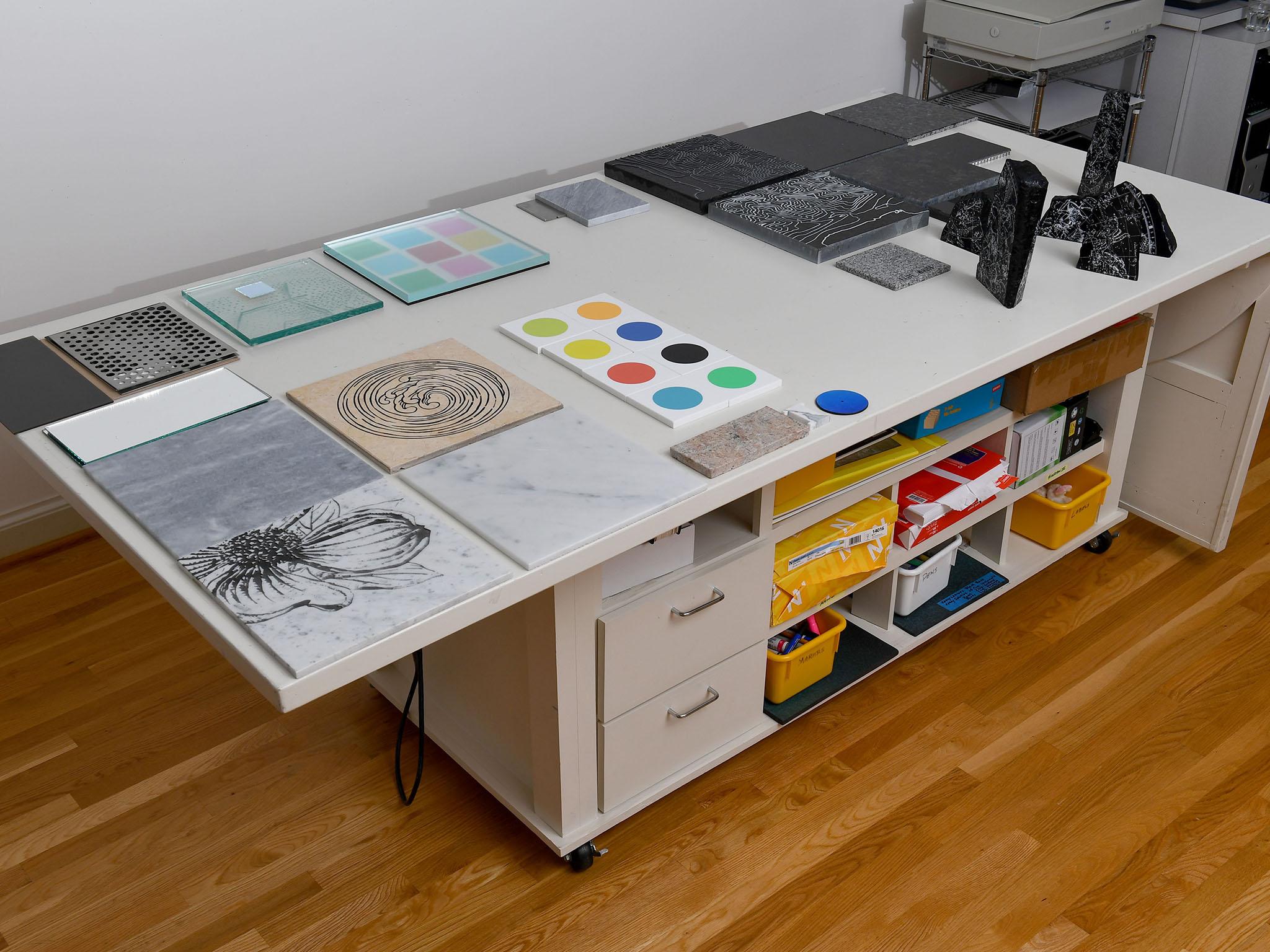 Kirkland has a large metal layout table in the centre that can easily be moved around his home to double as a serving table for dinner parties