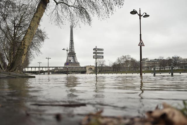 A photo taken on 23 January shows flooded banks of the river Seine, which has overflown after torrential rain has battered Paris
