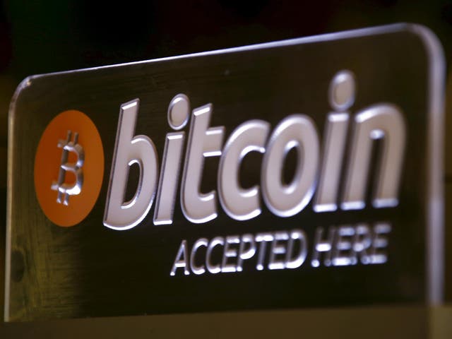 A Bitcoin sign can be seen on display at a bar in central Sydney, Australia, September 29, 2015