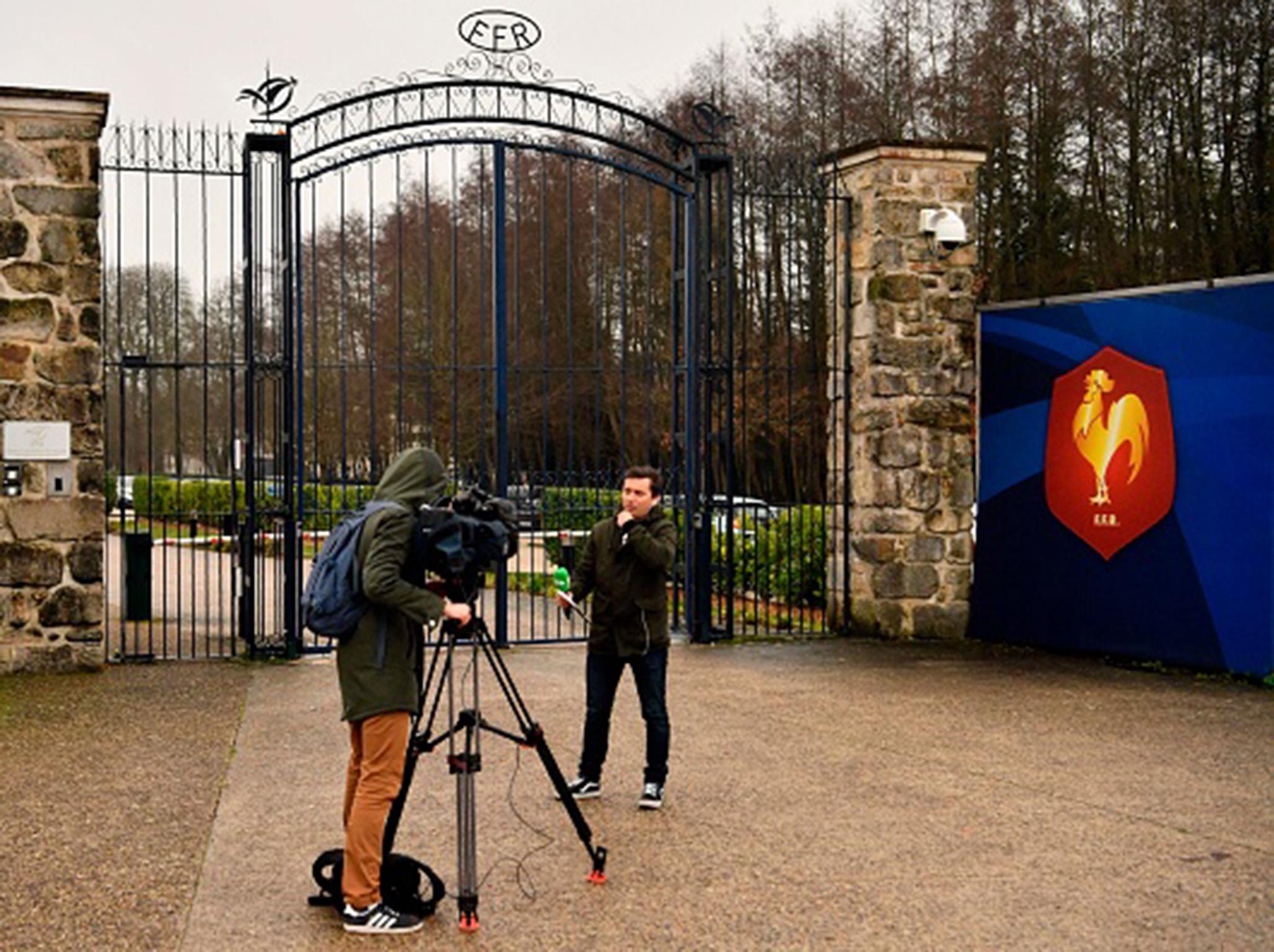 Reporters broadcast outside the French Rugby Federation headquarters