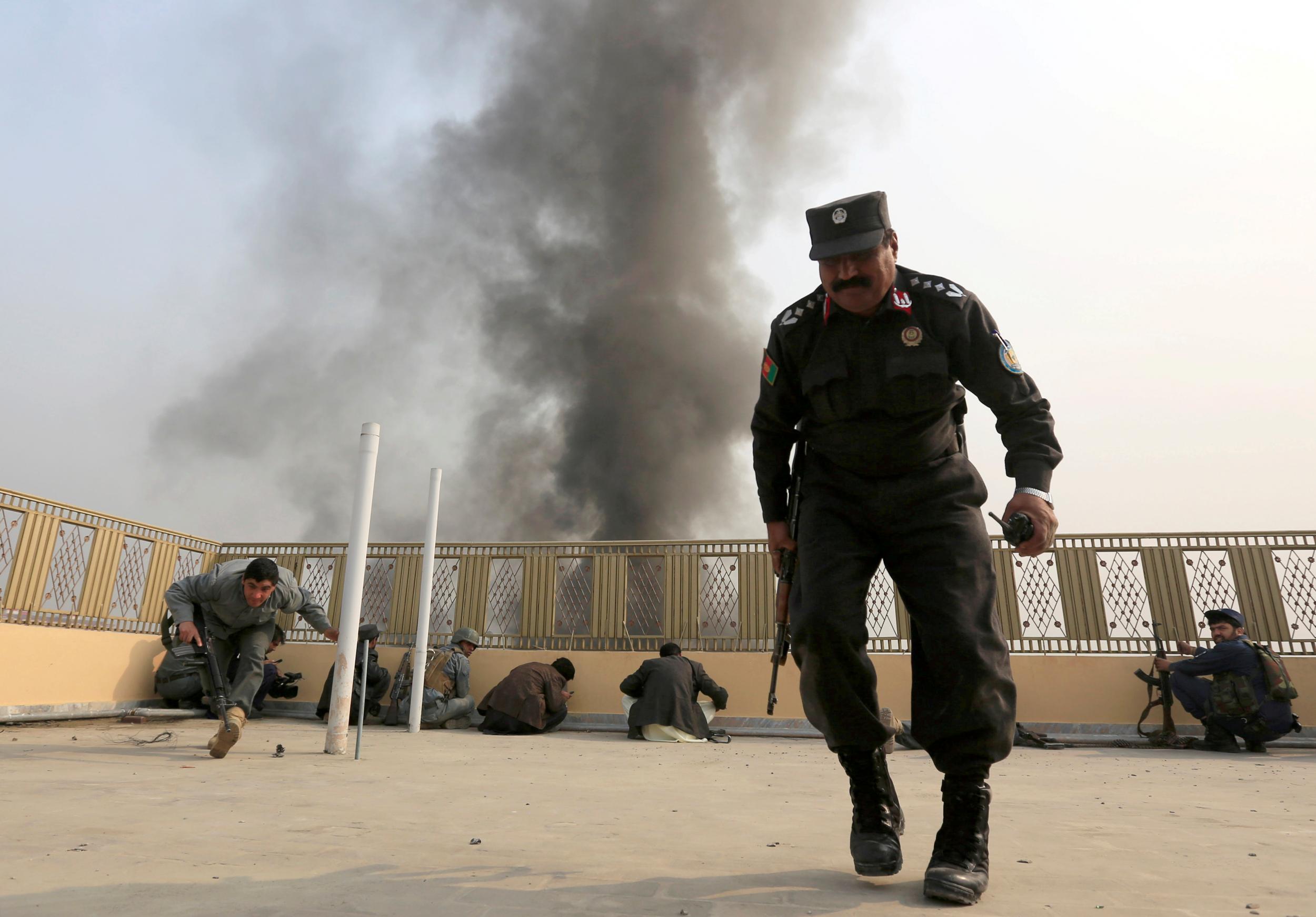 Afghan police officers take position during the fight against Isis militants in Jalalabad