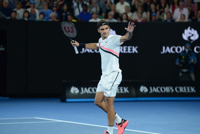 Roger Federer celebrates after his victory over Tomas Berdych