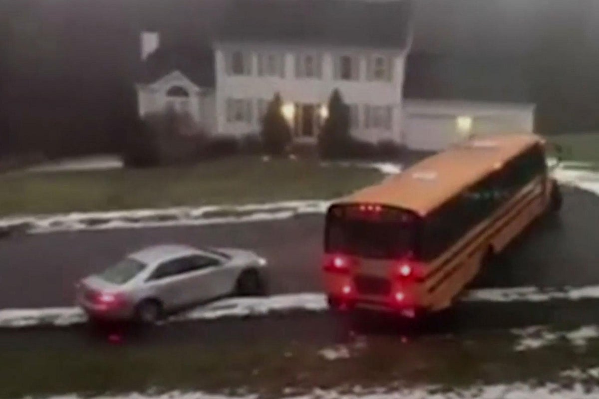 School bus full of children skids down icy hill in dramatic footage ...