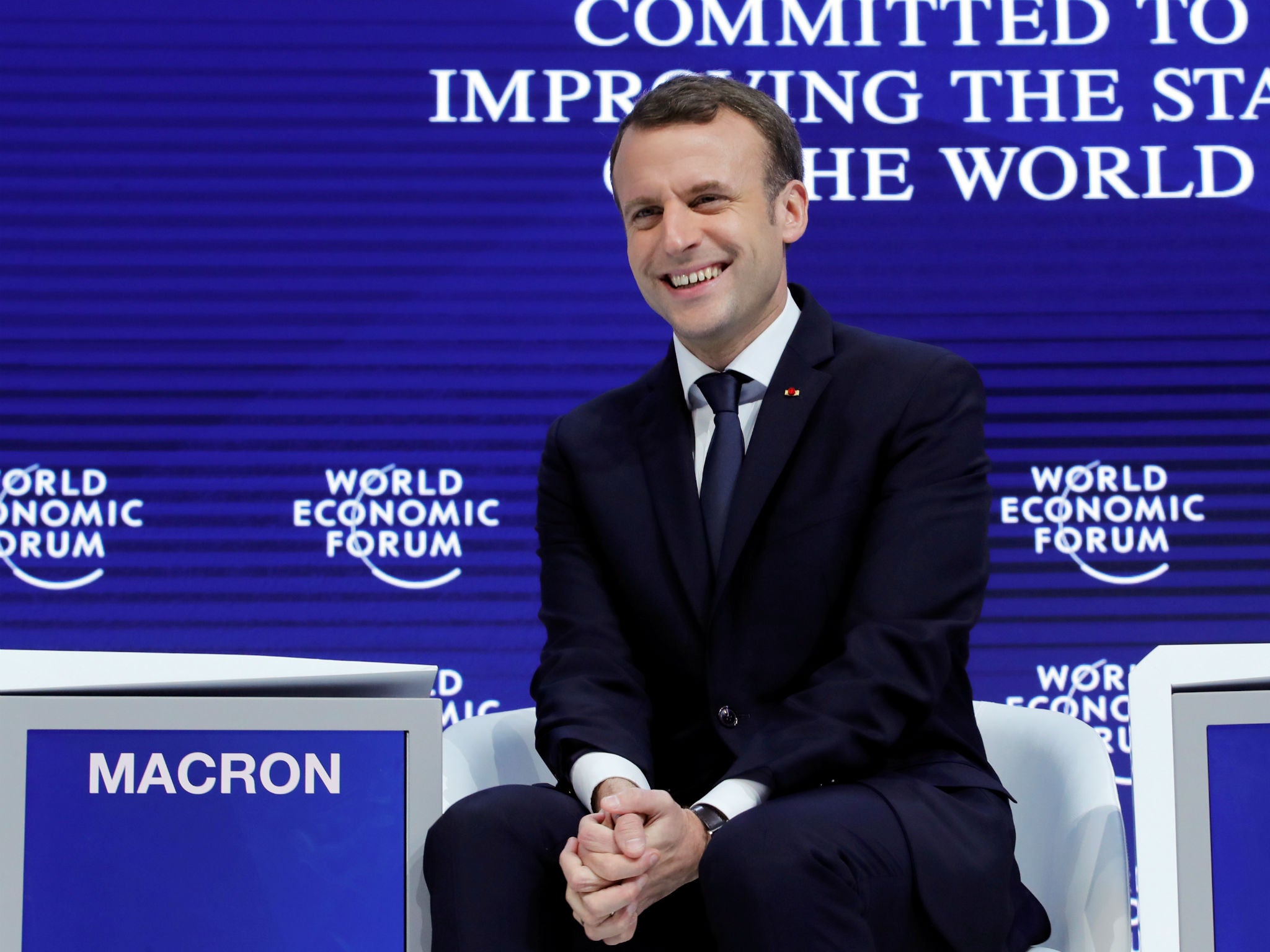 Emmanuel Macron gestures at the World Economic Forum annual meeting in Davos, Switzerland