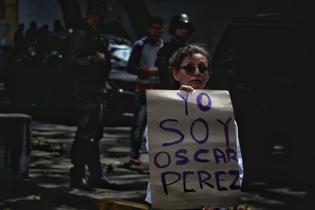 ‘I am Oscar Perez’ is the message near Caracas morgue, where relatives of Perez looking for his body in the days after his death were prevented by the national guard from entering