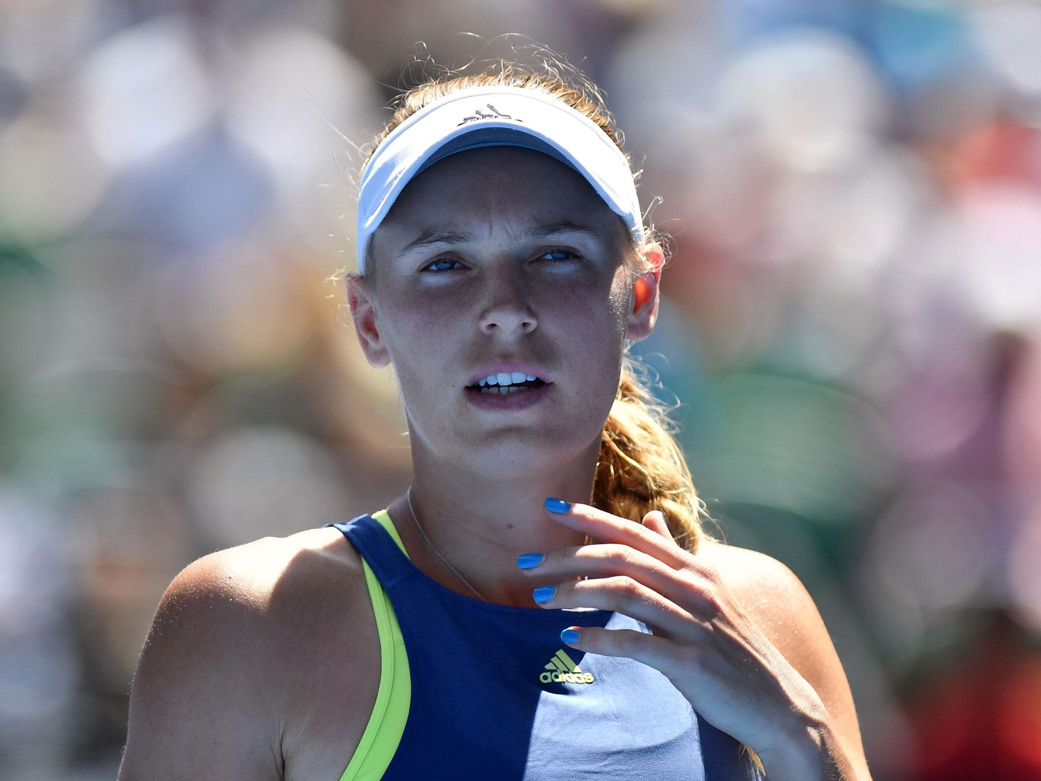 Caroline Wozniacki held on to see off Elise Mertens