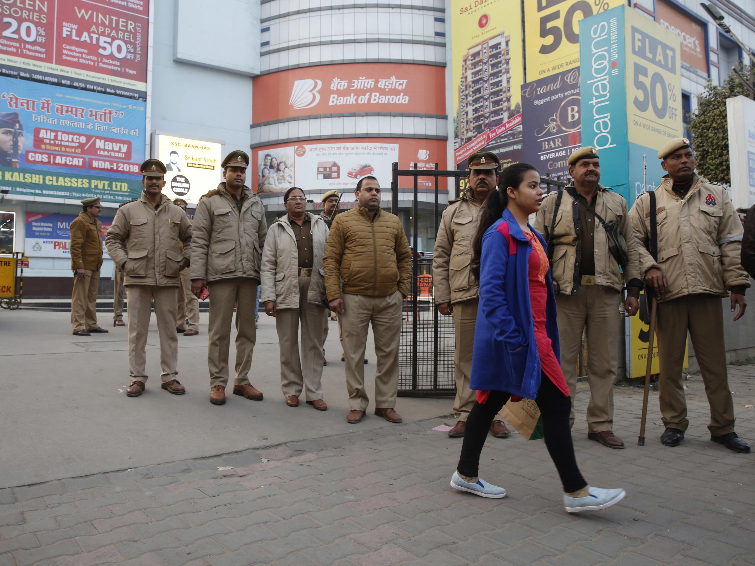 Indian policemen stand guard outside a cinema hall before a scheduled show of Bollywood film ‘Padmaavat’ in Allahabad