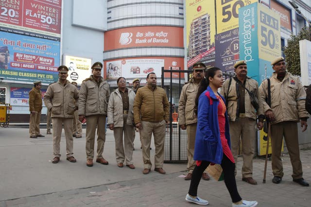 Indian policemen stand guard outside a cinema hall before a scheduled show of Bollywood film ‘Padmaavat’ in Allahabad