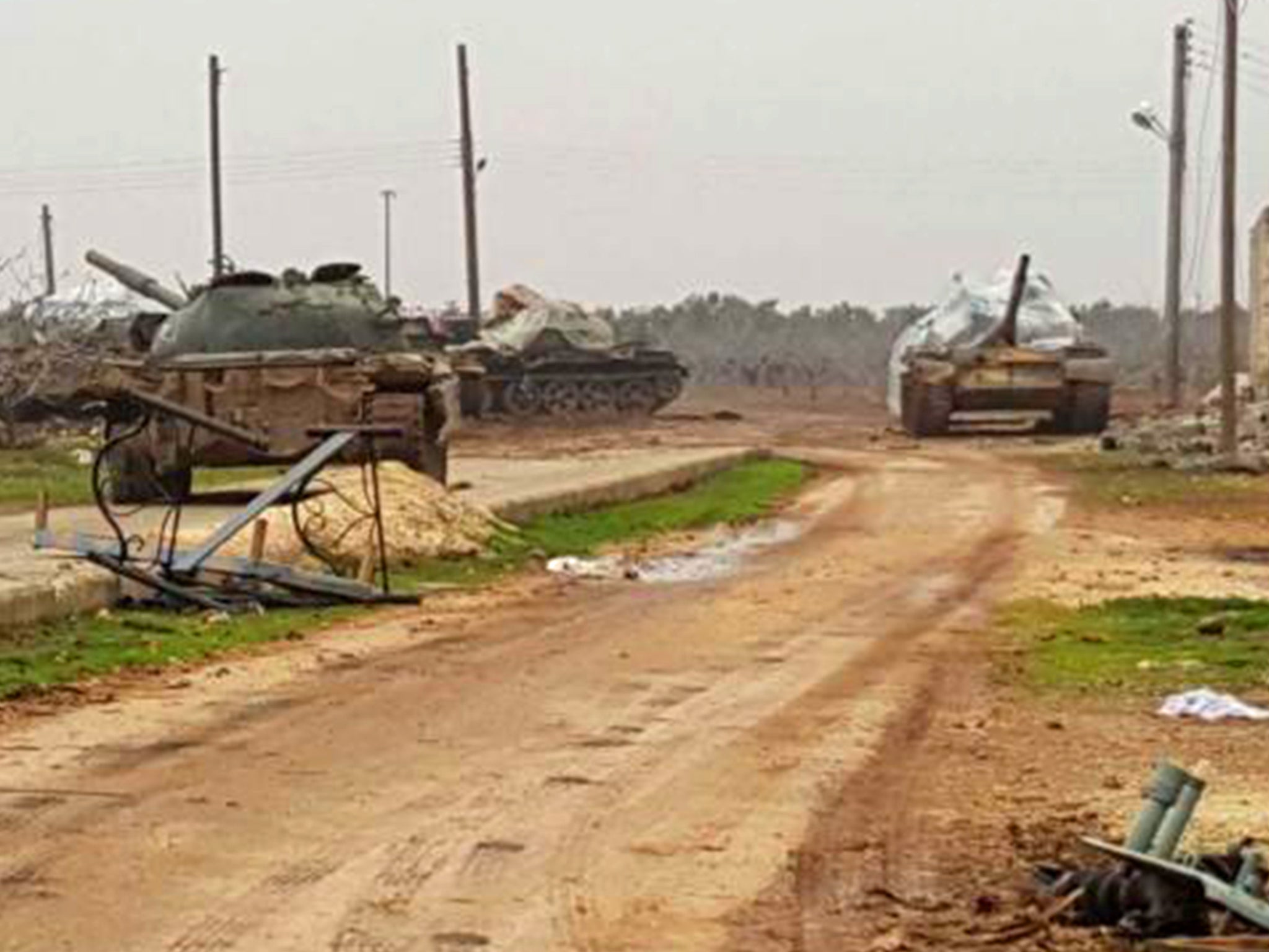 A Syrian tank unit waits on the outskirts of Sinjar for the next battle against al-Nusra fighters