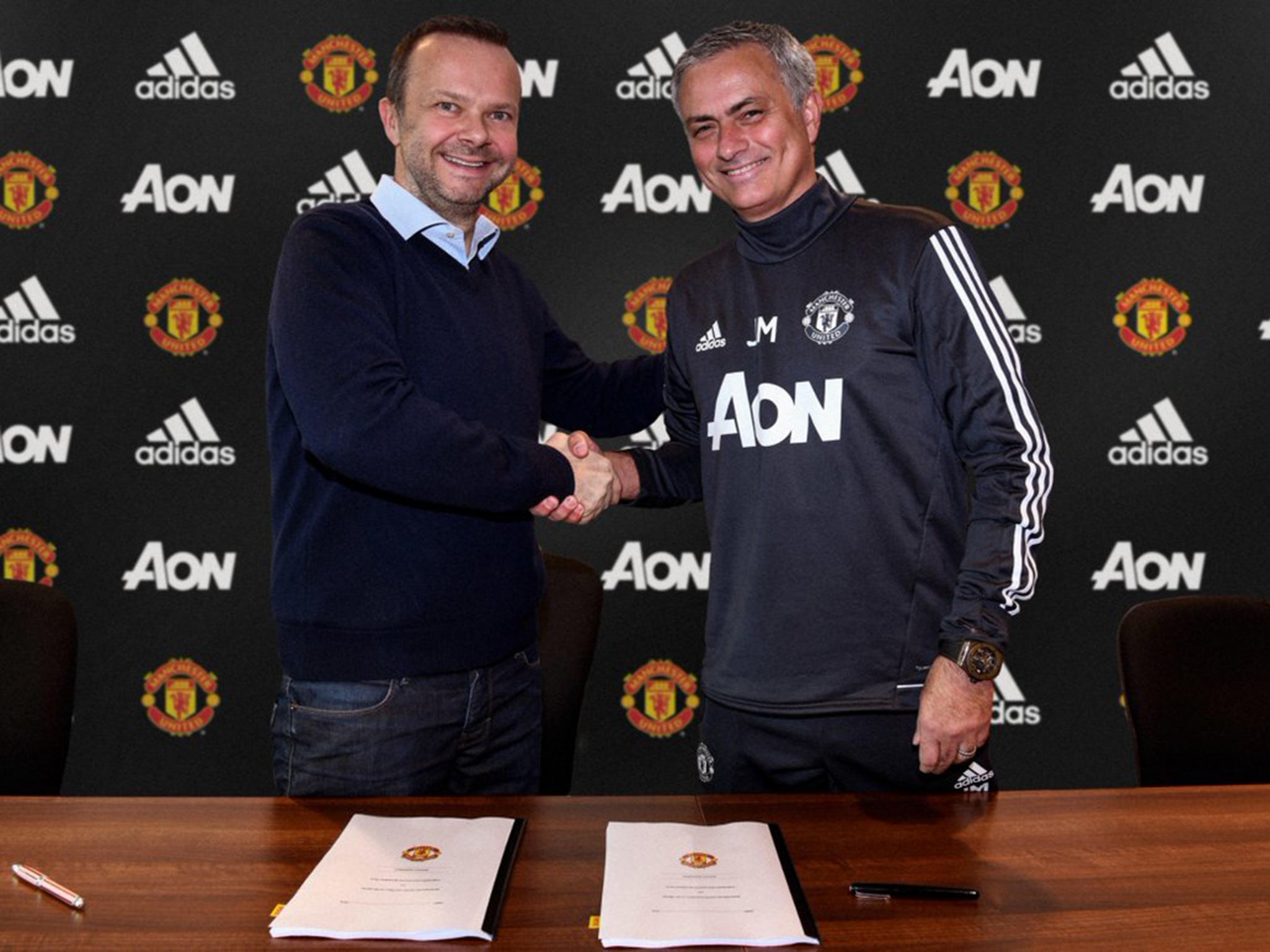 Manchester United executive vice-chairman Ed Woodward with Jose Mourinho after announcing his new contract