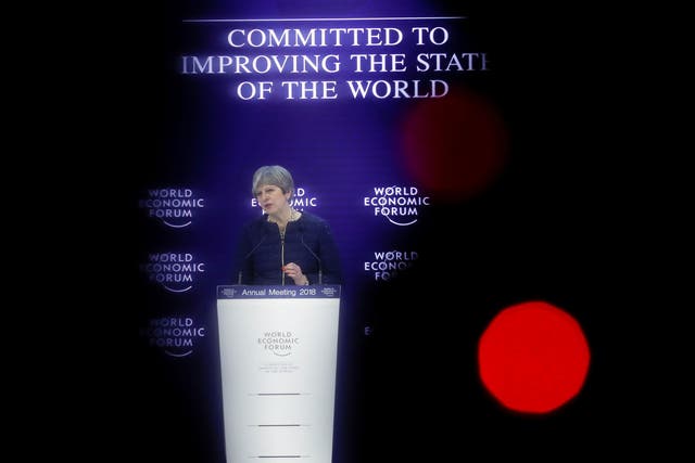 Theresa May addresses a speech during the World Economic Forum (WEF) annual meeting in Davos