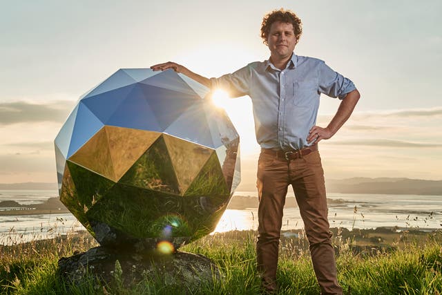 Rocket Lab founder and CEO Peter Beck is pictured with his "Humanity Star" in Auckland