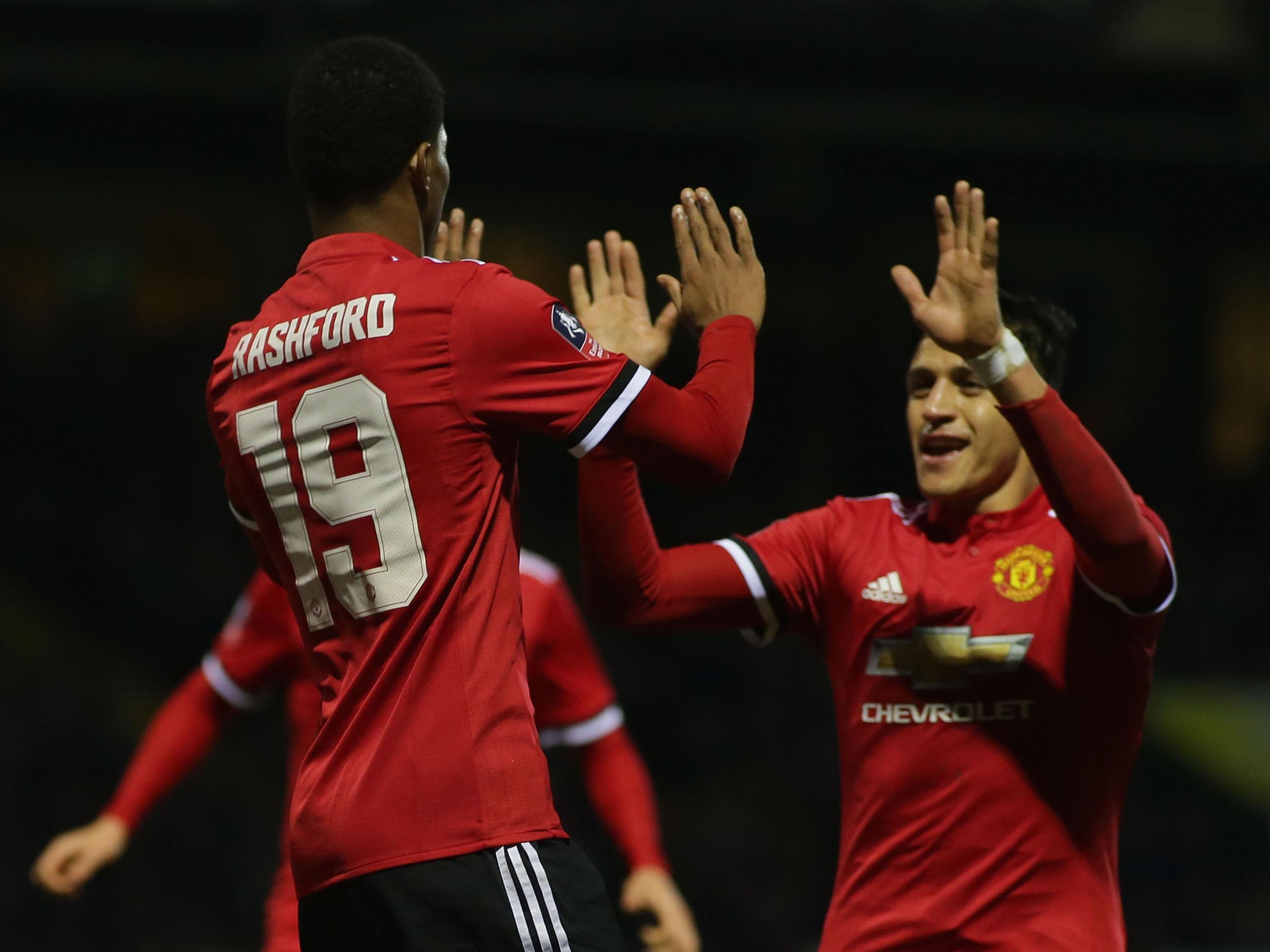 Marcus Rashford celebrates with Alexis Sanchez after putting United ahead