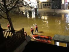 Rescue boats deployed to save people trapped by flooding in London