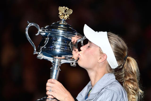 Caroline Wozniacki claims her first Grand Slam title at the 43rd attempt