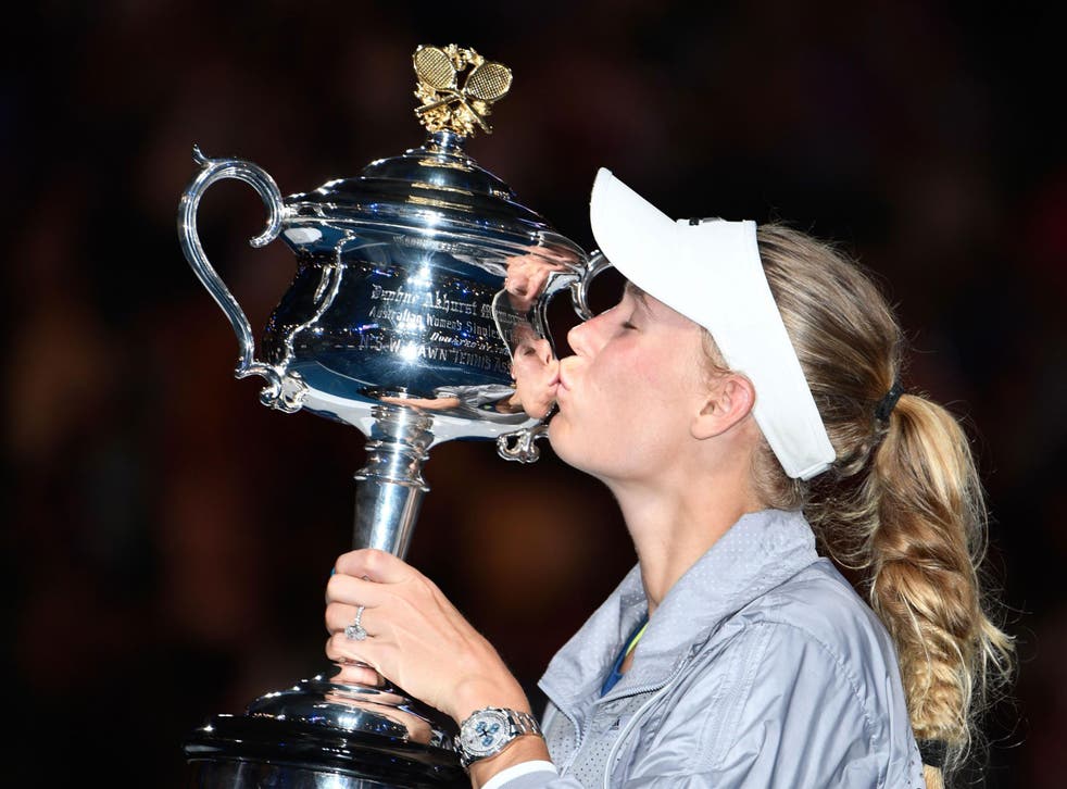 Caroline Wozniacki claims her first Grand Slam title at the 43rd attempt