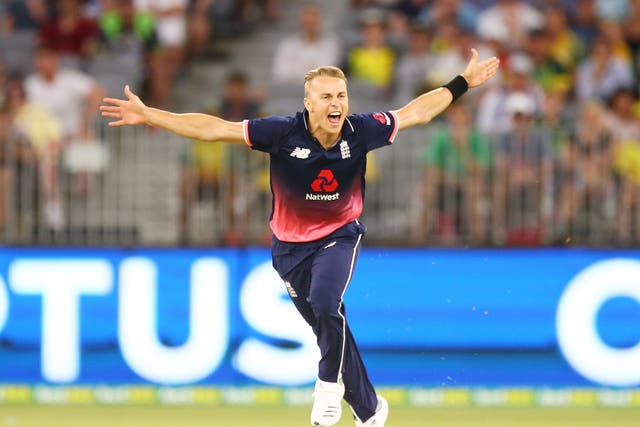 Tom Curran celebrates taking the final wicket of Tim Paine to seal victory for England