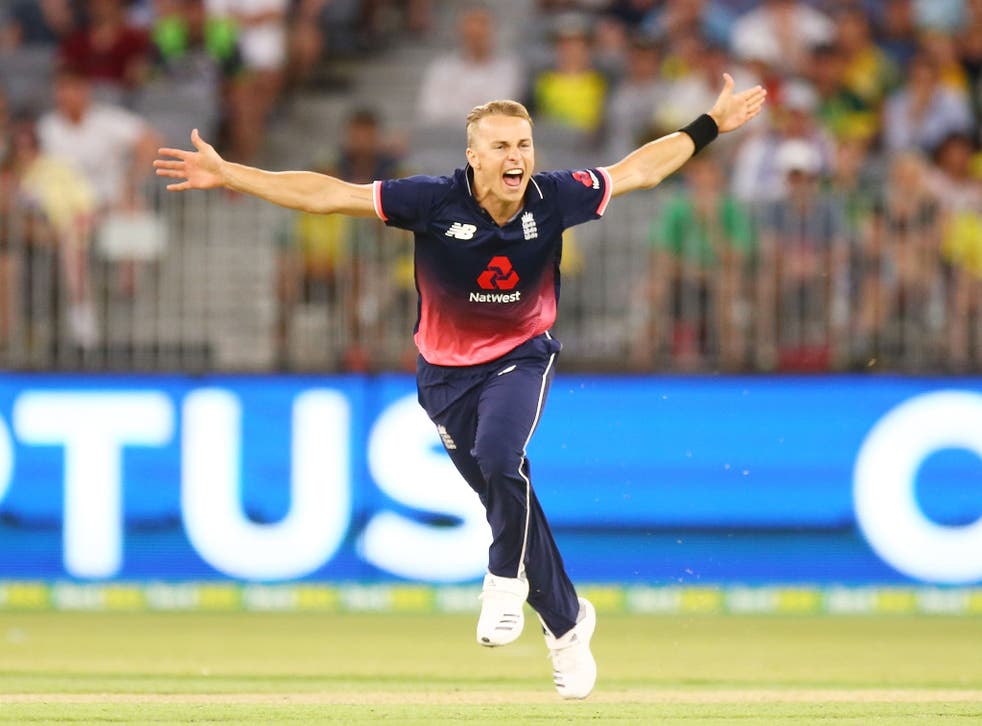 Tom Curran celebrates taking the final wicket of Tim Paine to seal victory for England