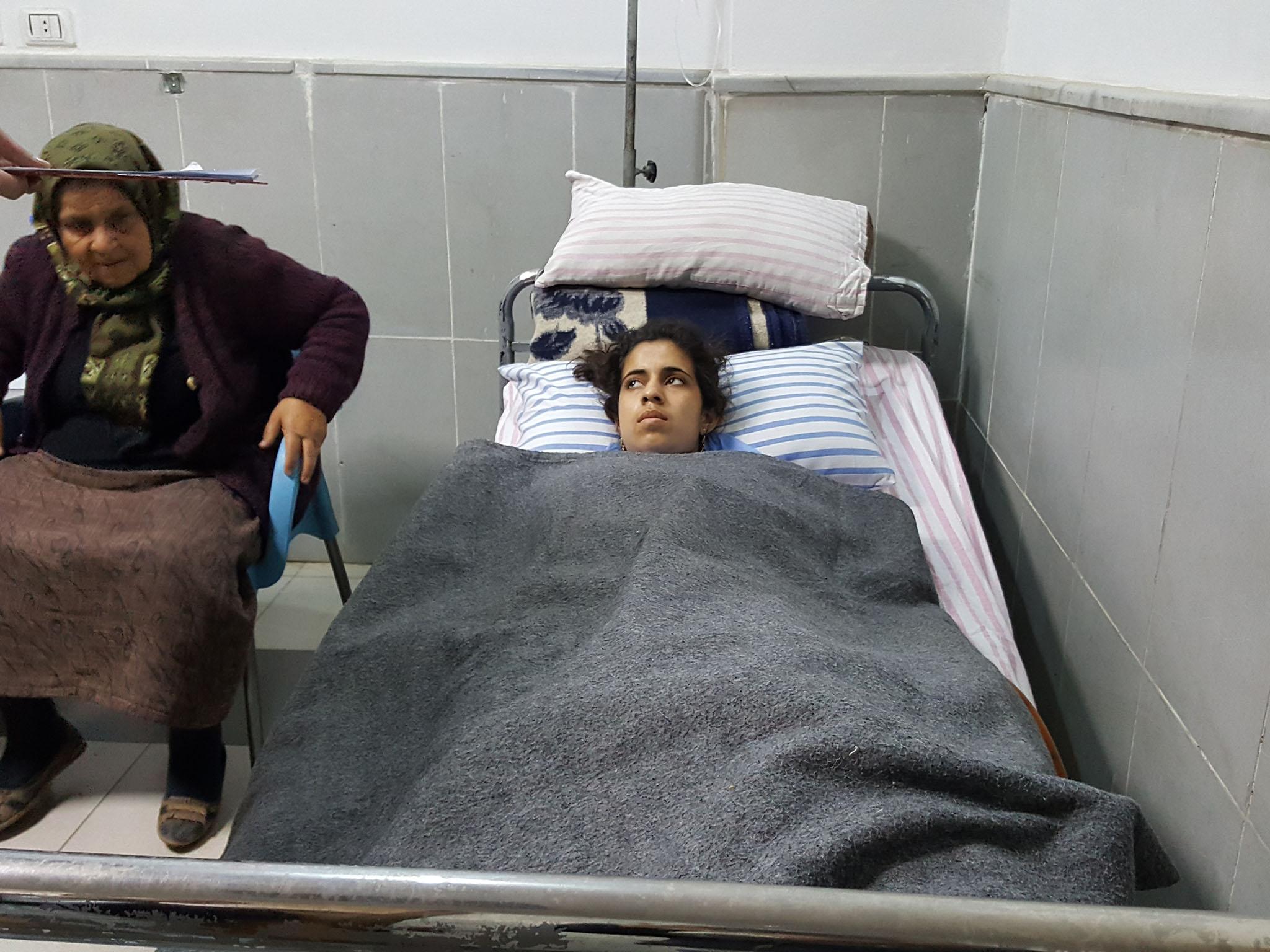 Lying in the Afrin hospital, 15-year old Dananda Sido, wounded in the legs and chest running in the street from a Turkish air attack in the Kurdish village of Adamo