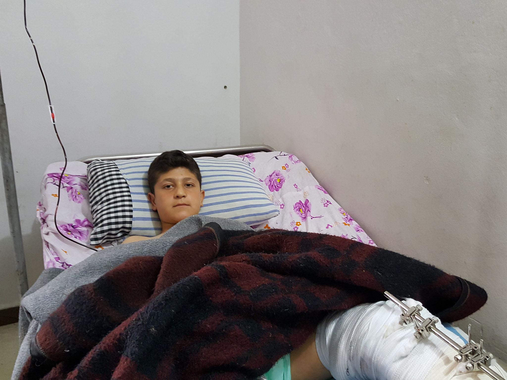 Eight-grade schoolboy Mustafa Khaluf heard the Turkish plane that, moments later, bombed his home and wounded him in the leg, also badly injuring his sister