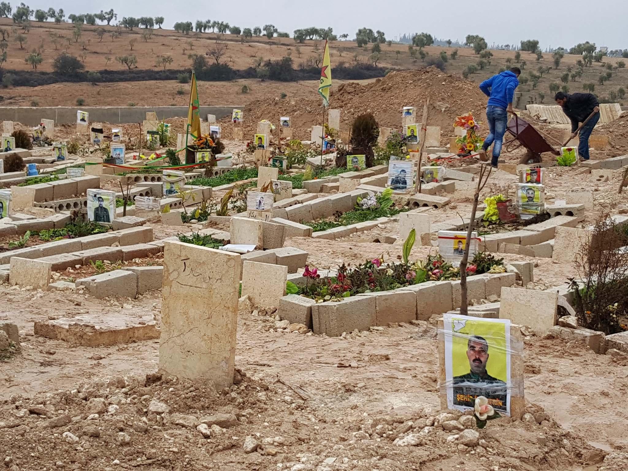 Fresh graves for the Kurds of Afrin. The digging machines are preparing for the bodies of eight Kurdish militiamen and civilians killed by Turkish fire in the Syrian province last week