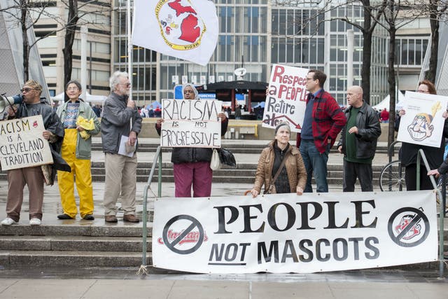 People protest Chief Wahoo outside prior to a game between the Cleveland Indians and the Minnesota Twins in Cleveland, Ohio