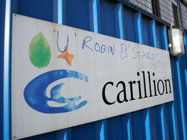 Defaced branding is seen outside Carillion's Royal Liverpool Hospital site which is being built by the construction company