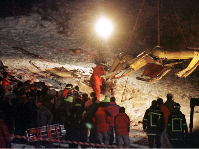 The scene at the Italian ski resort of Cavalese after a US military plane from the Aviano Nato airbase hit the cable car, killing all 20 people on board