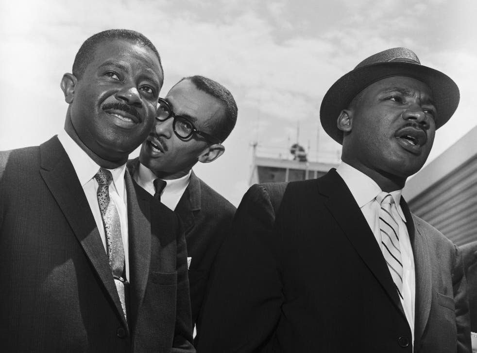 Walker (centre) in 1961 with Martin Luther King Jr (right) and Rev Ralph Abernathy shortly before King addressed crowds in Montgomery, Alabama following an outbreak of racial violence