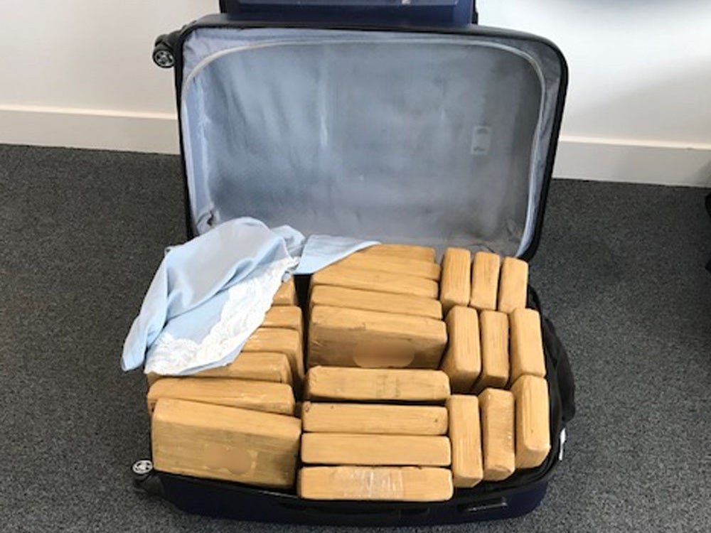 A suitcase containing packages of cocaine found on board