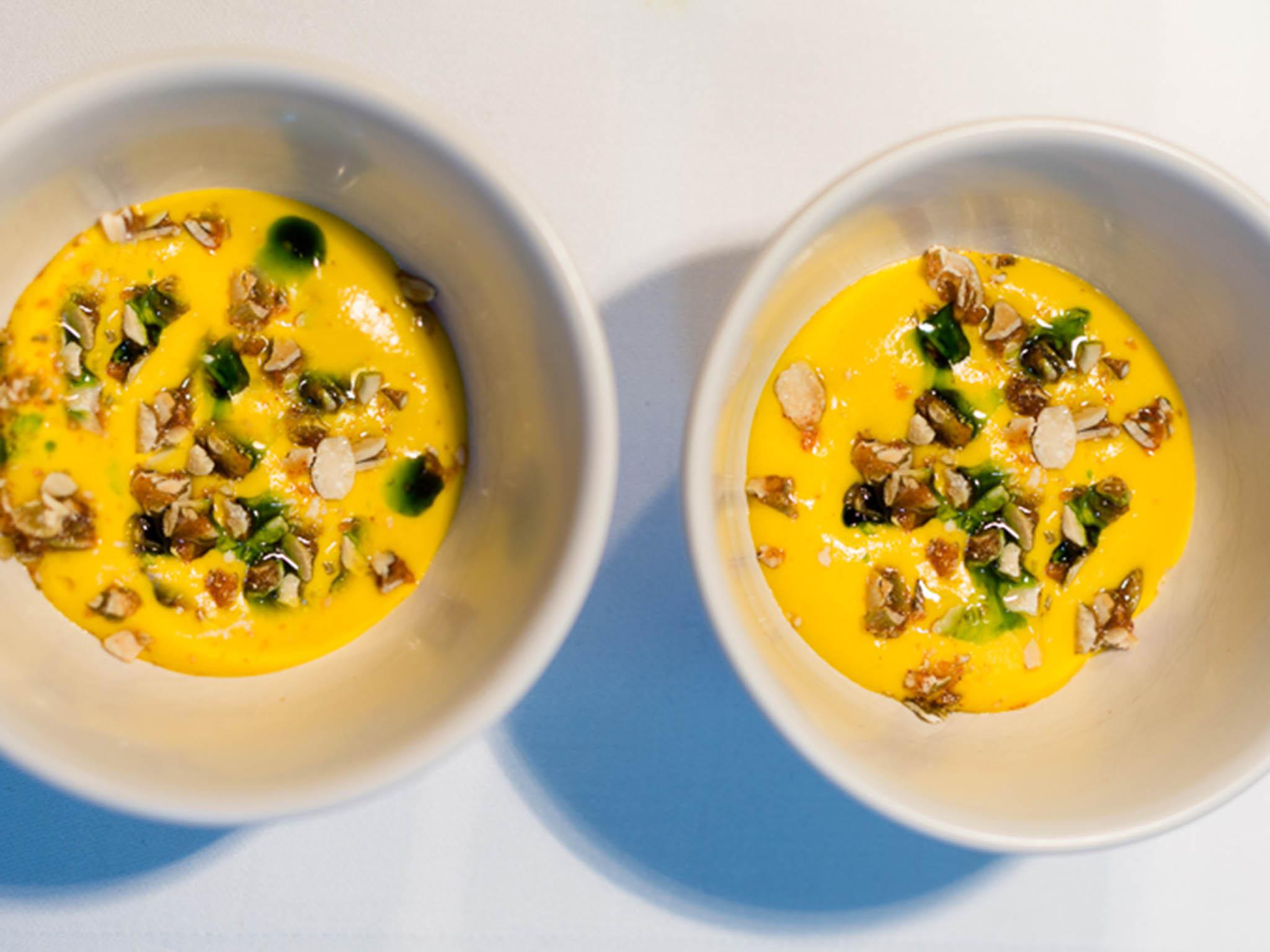 The pumpkin soup mousse is served slightly warm and topped with crunchy pistachios