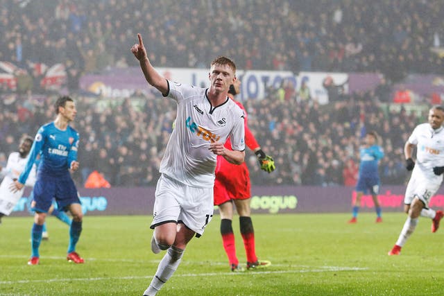 Sam Clucas celebrates after equalising for Swansea following Nacho Monreal's opener