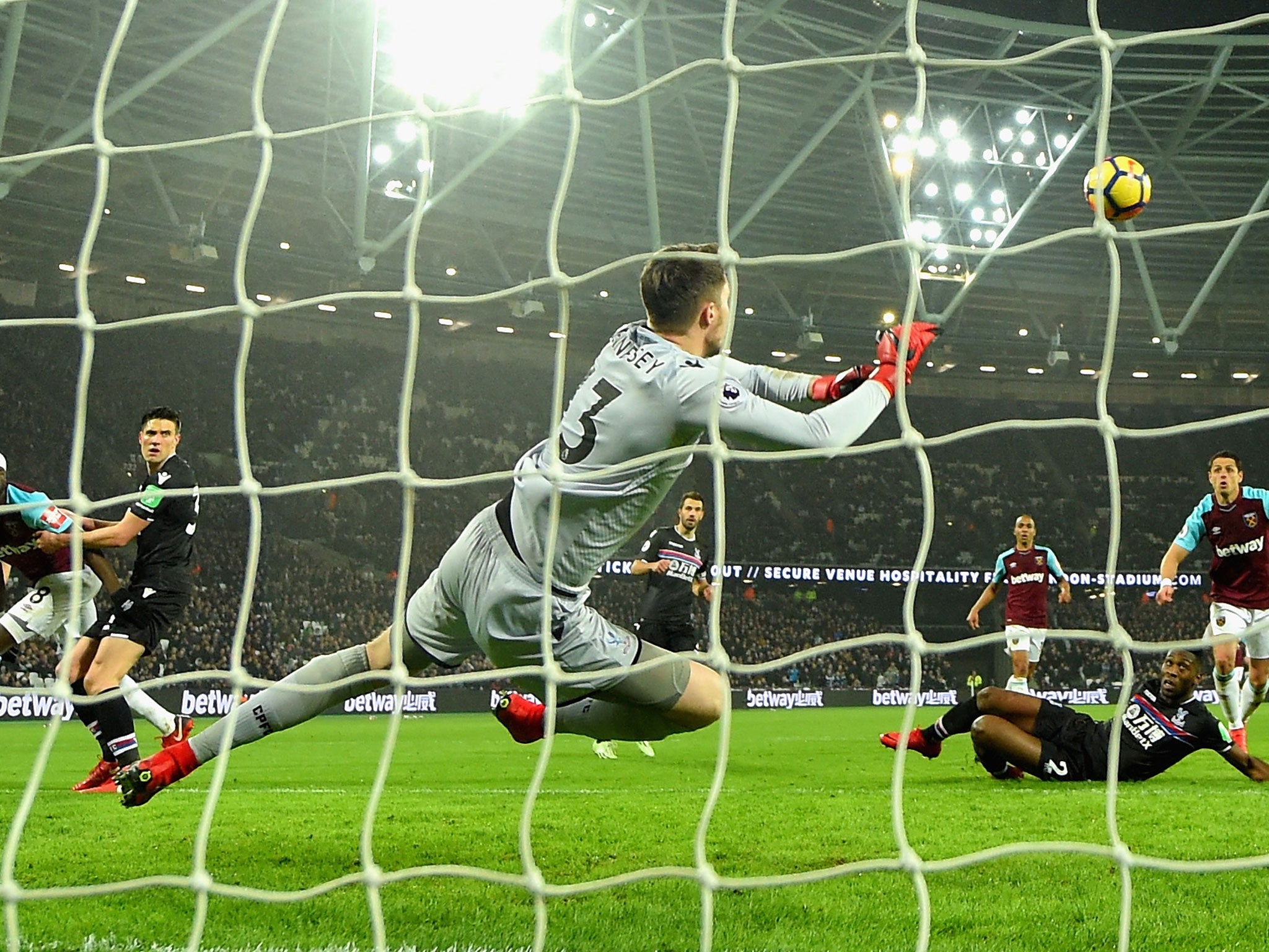 Wayne Hennessey makes a diving save to deny Javier Hernandez's attempt on goal