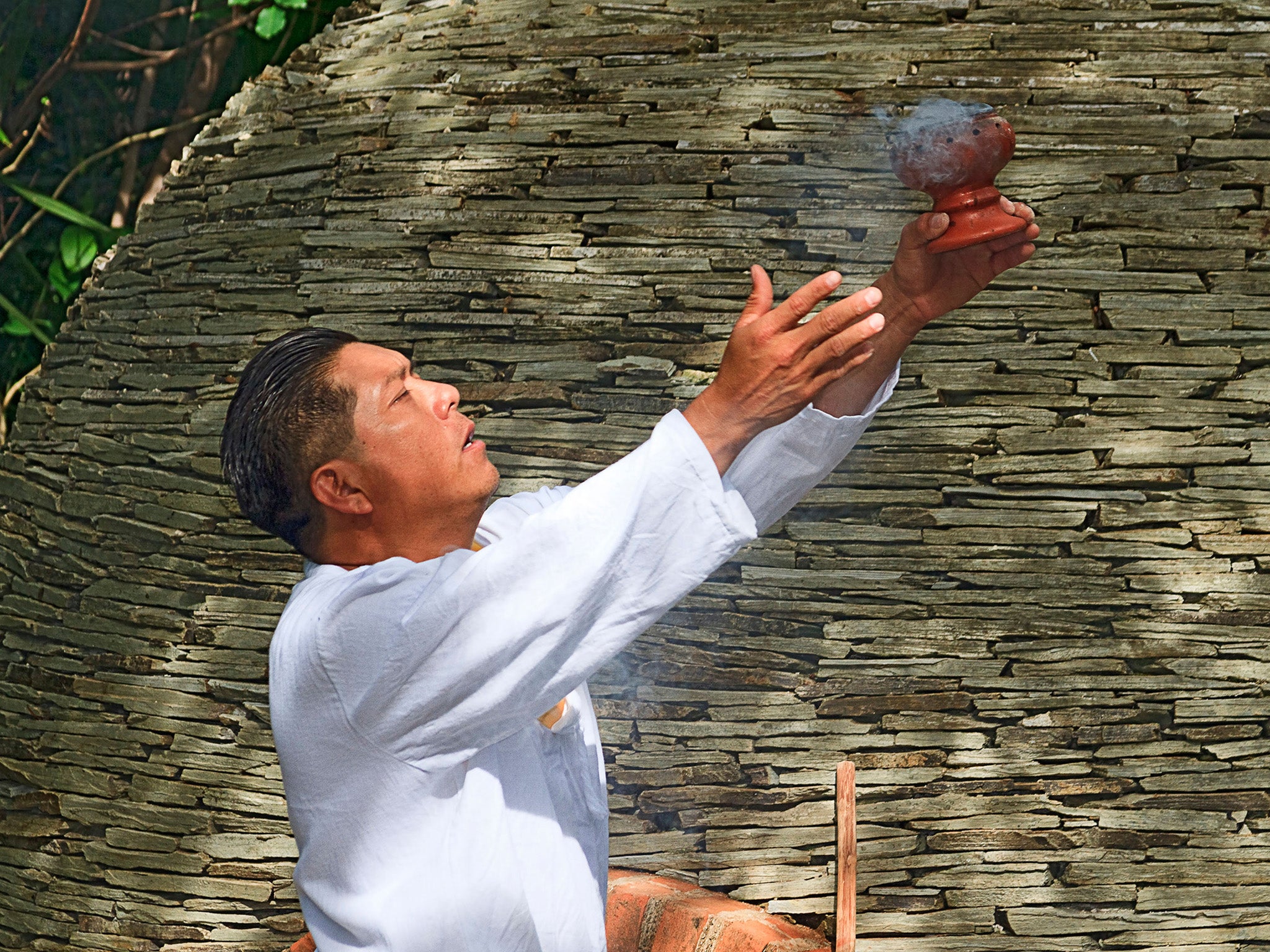 Maya Shaman greets visitors with ritual smoke from Copal resin