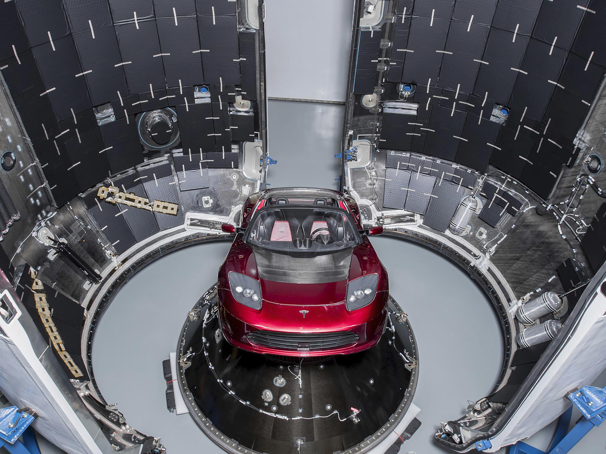 The cherry-red Tesla Roadster on the Falcon Heavy, a beefed-up version of SpaceX’s workhouse Falcon 9 rocket
