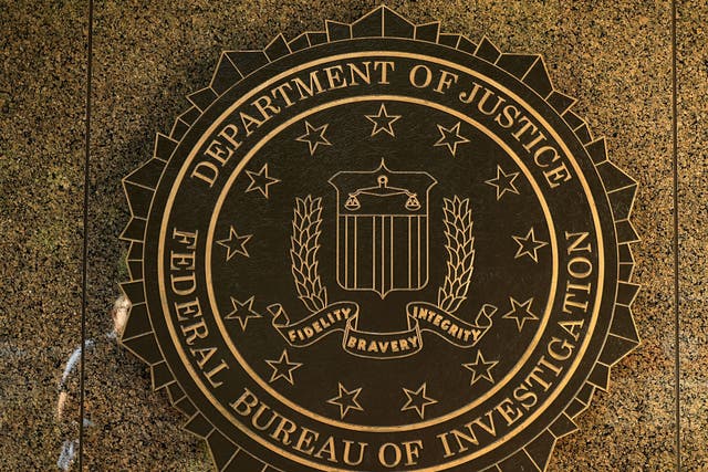 The seal of the Federal Bureau of Investigation hangs on the outside of the bureau's Washington, DC headquarters