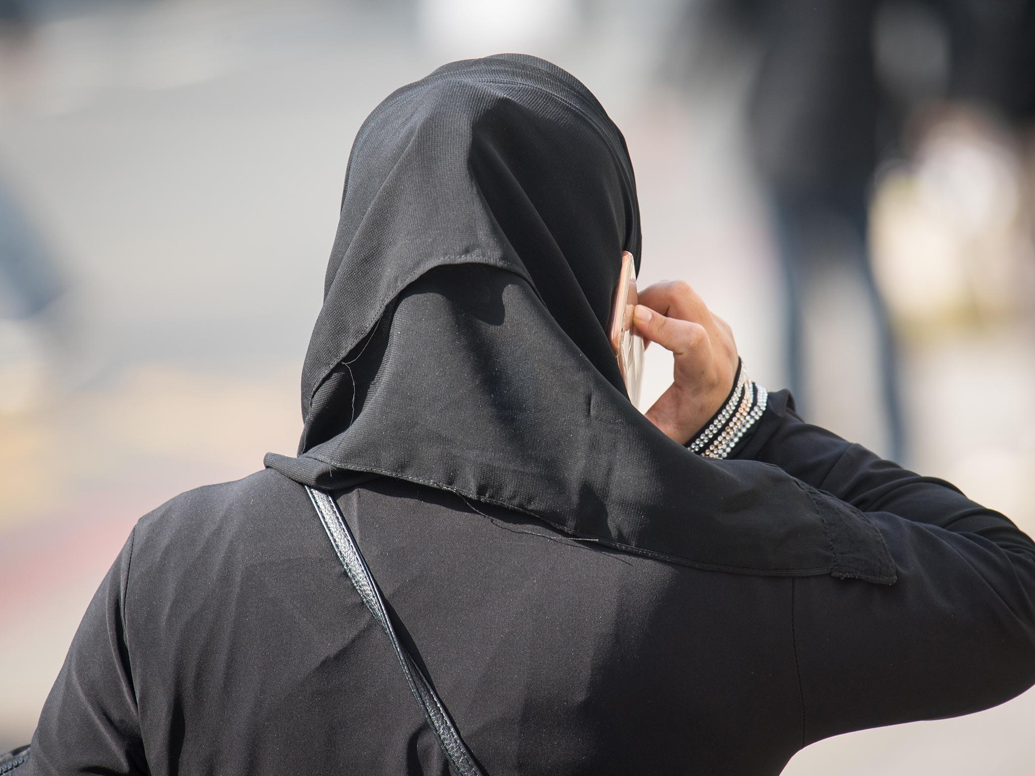 Posters encouraged women to wear the hijab or niqab, before they were taken down after protests