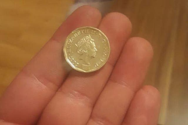 One side has the old £1 coin while the other is minted with the new bi-metal coin