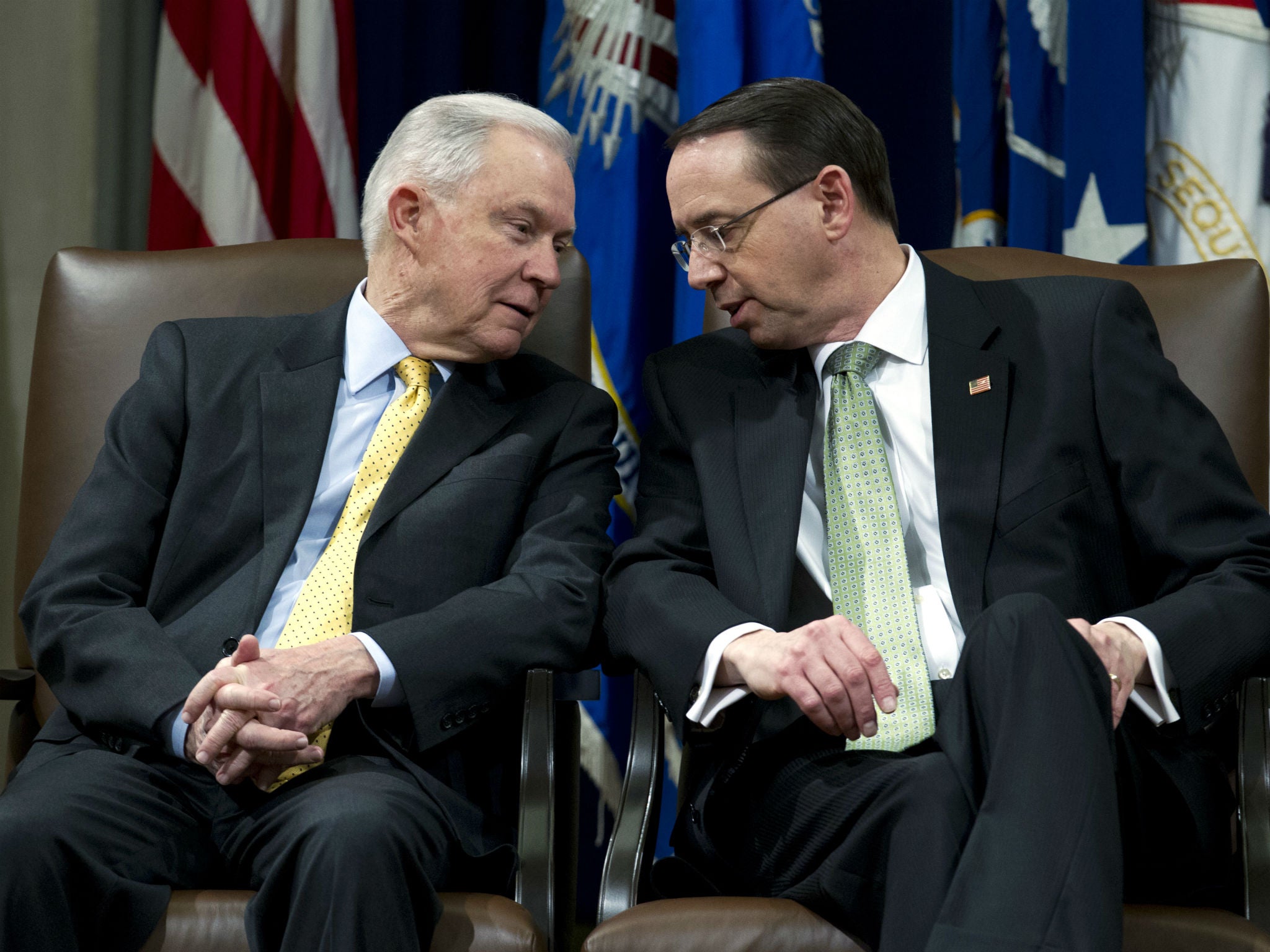 Attorney General Jeff Sessions speaks with Deputy Attorney General Rod Rosenstein at the Department of Justice in Washington