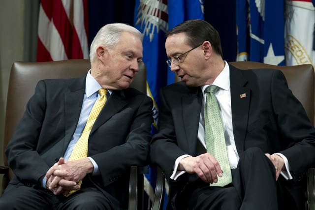 Attorney General Jeff Sessions speaks with Deputy Attorney General Rod Rosenstein at the Department of Justice in Washington