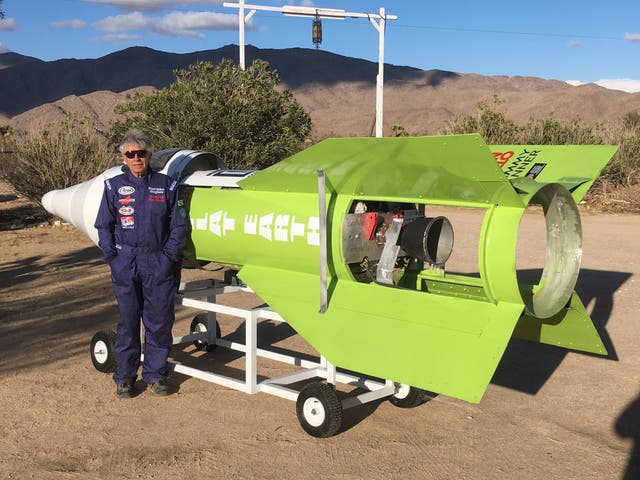 Mad Mike Hughes posing next to his rocket