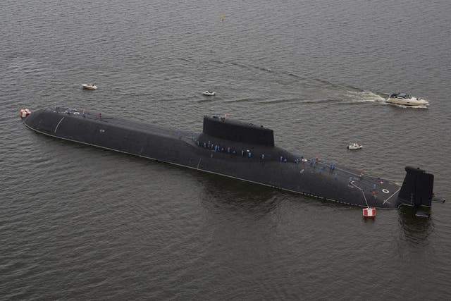An aerial view shows the Russian nuclear submarine Dmitry Donskoy moored on the eve of the the Navy Day parade in Kronshtadt, a seaport town in the suburb of St. Petersburg, Russia