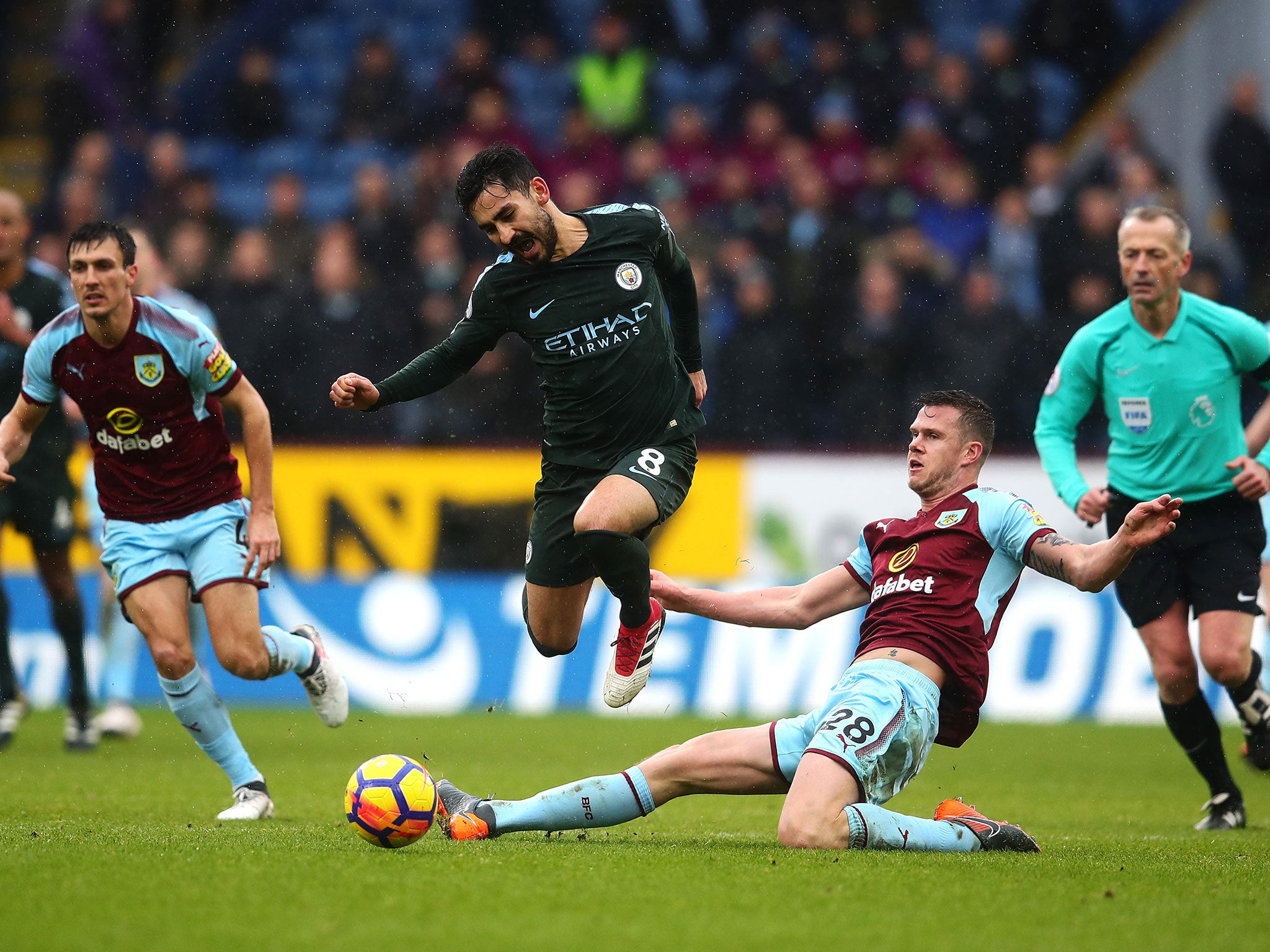 Kevin Long brings down Ilkay Gundogan