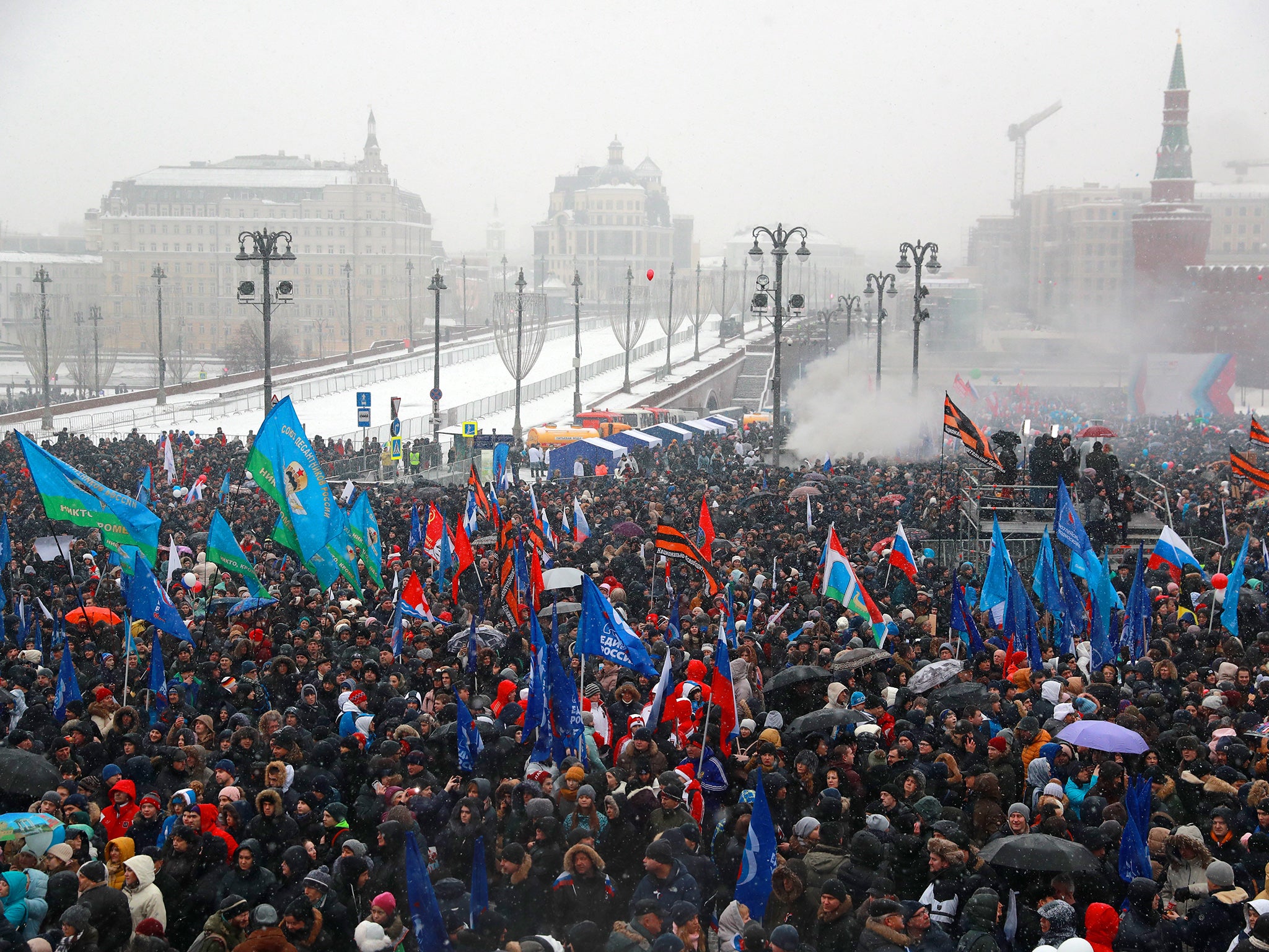 People take part in a rally titled ‘Russia is in my heart!’ in Vasilyevsky Spusk Square near Moscow’s Kremlin