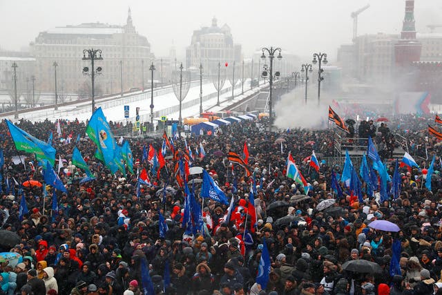 People take part in a rally titled ‘Russia is in my heart!’ in Vasilyevsky Spusk Square near Moscow’s Kremlin