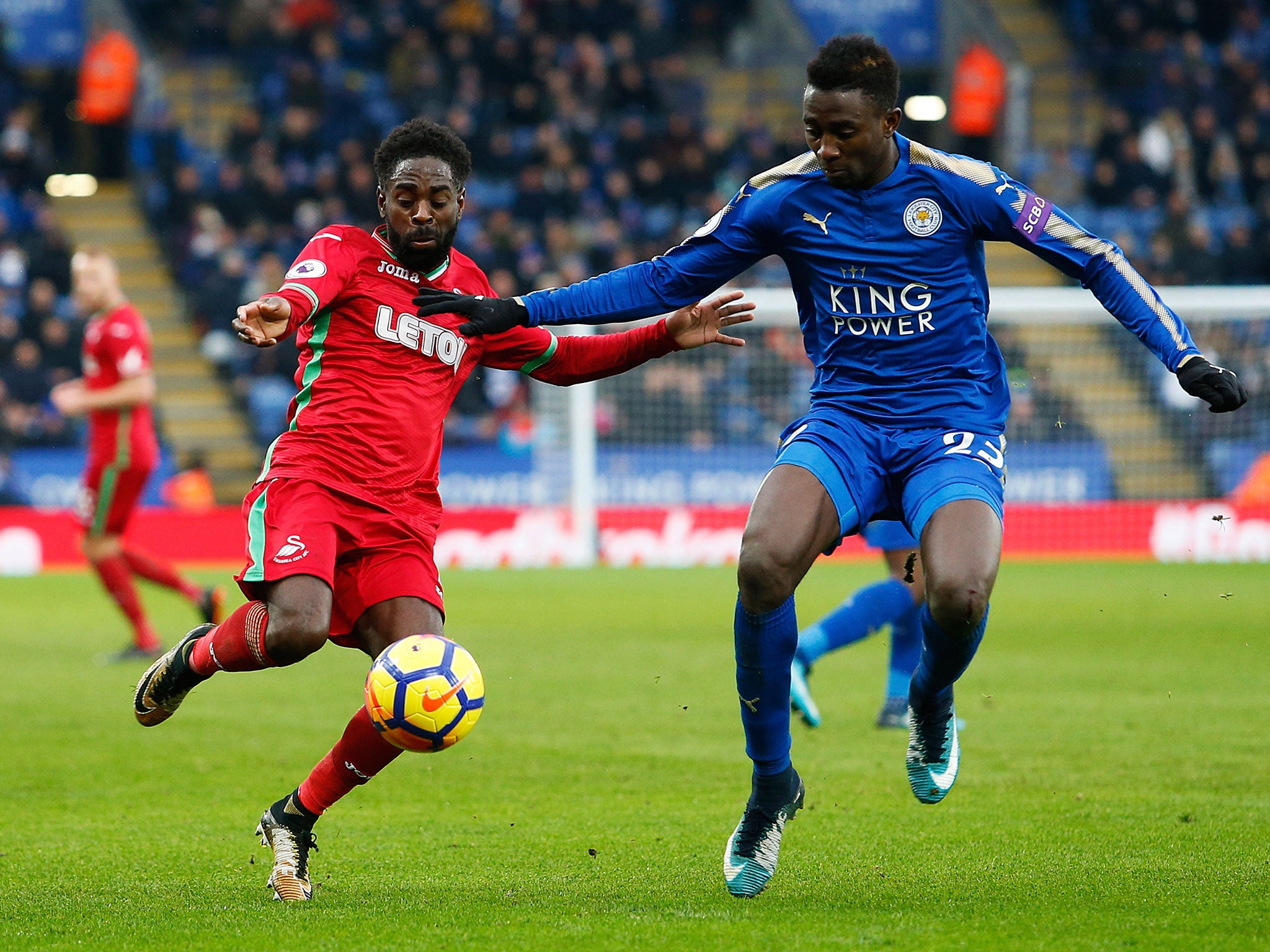 Nathan Dyer is challenged by Wilfred Ndidi